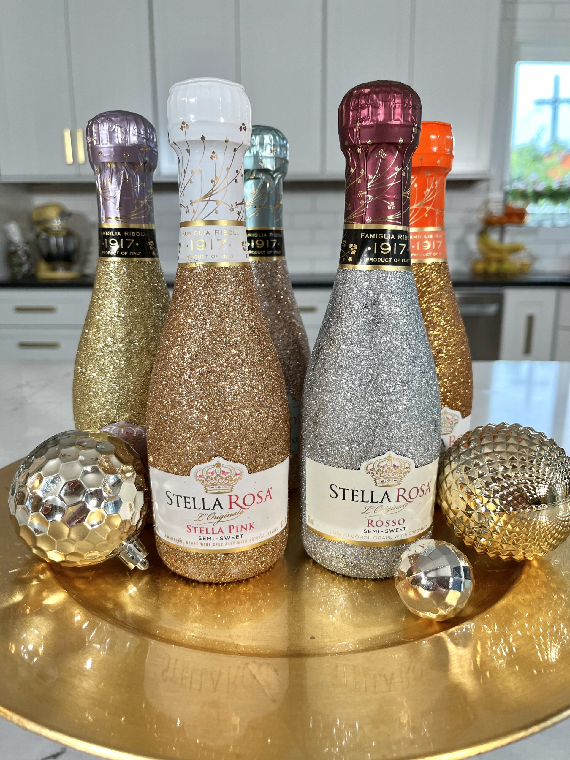https://www.cathiefilian.com/wp-content/uploads/2022/12/glittered-wine-champange-bottles-scaled.jpeg